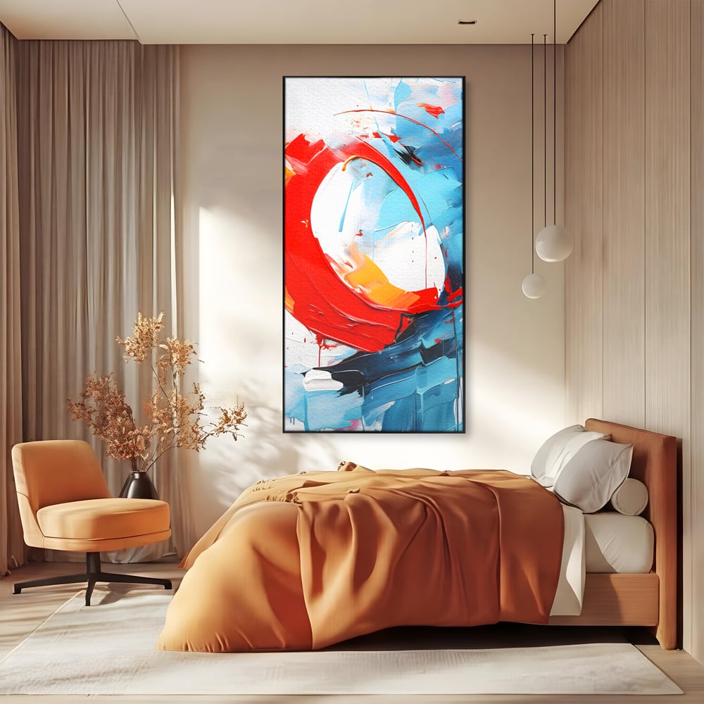 Tablou canvas cu pictura abstracta cu cerc rosu si tuse albastre, in rama de aluminiu negru, pe perete intr-un dormitor